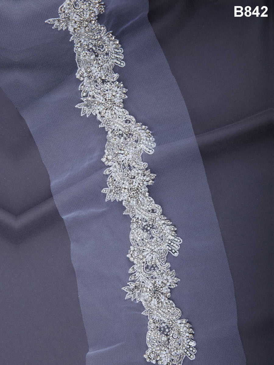 Beaded Blossoms: Hand-Beaded Trim showcasing a Stunning Array of Beads, Sparkling Sequins, and Elegant Floral Motifs